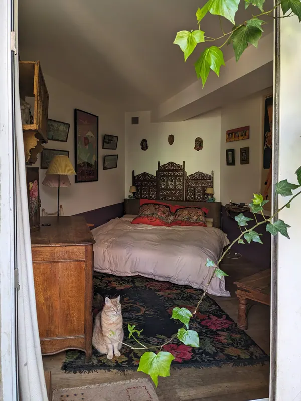 Bedroom opening onto the garden through a French window
