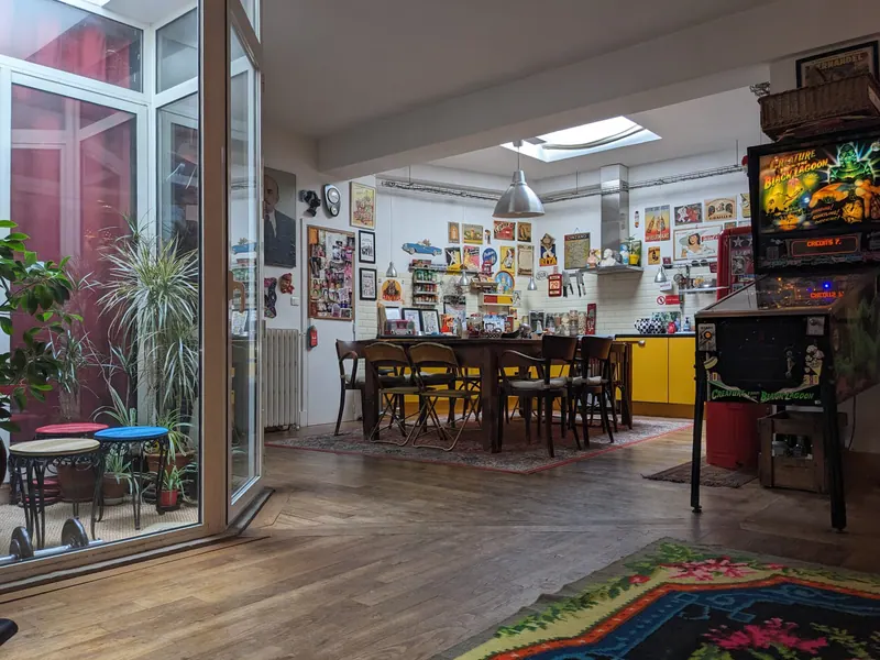Kitchen-dining room open to the glazed patio, old parquet floor